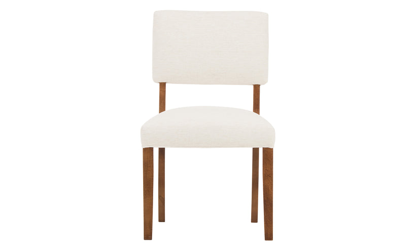 Upholstered dining chair with a warm auburn leg finish on a white background.