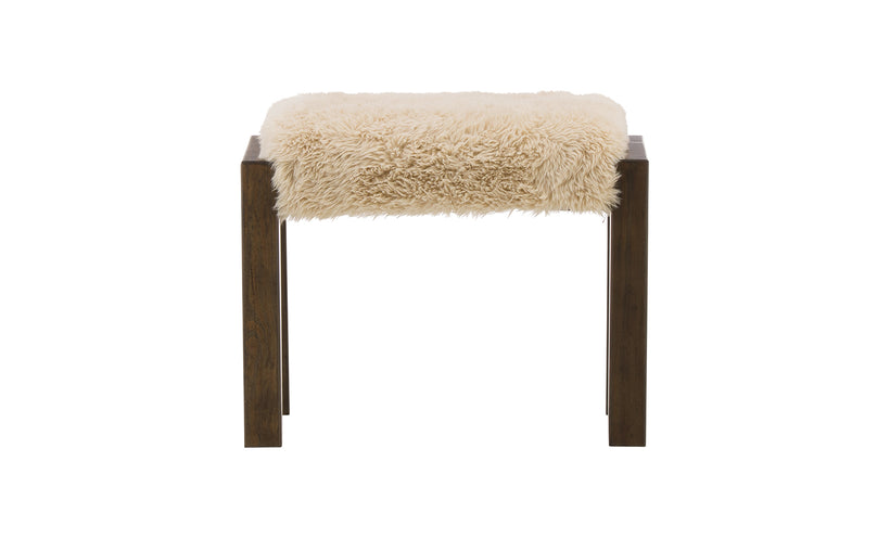 Stool with a fluffy beige cushion on a white background